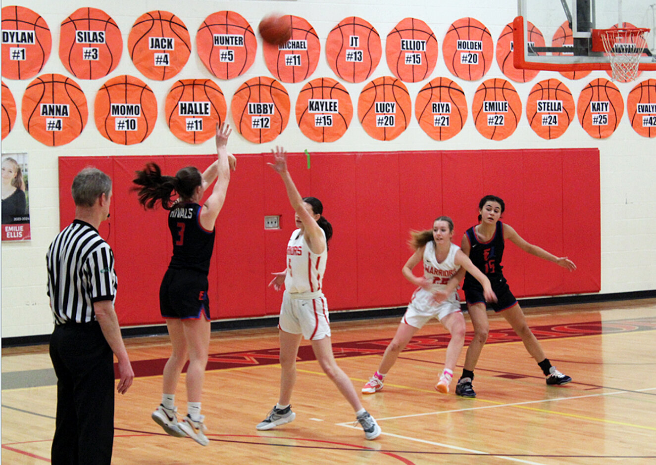 Rivals point guard Kay Botkin launches a three-point shot while post Penina Vailolo holds her position just outside the key. Photo by Jeremy Botkin